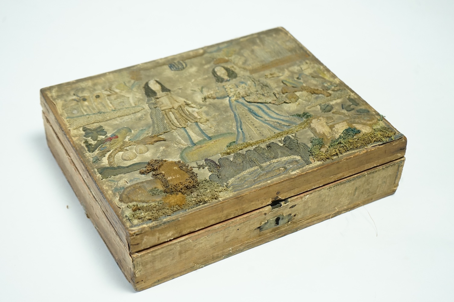 A late 17th century Charles II stump work box. The box originally embroidered to commemorate the marriage of Charles II to Catherine of Braganza in 1662. 31cm x 25.5cm deep., Condition - sadly during its 400 plus years o